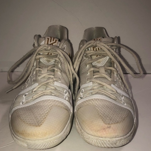 kyrie gold and white shoes